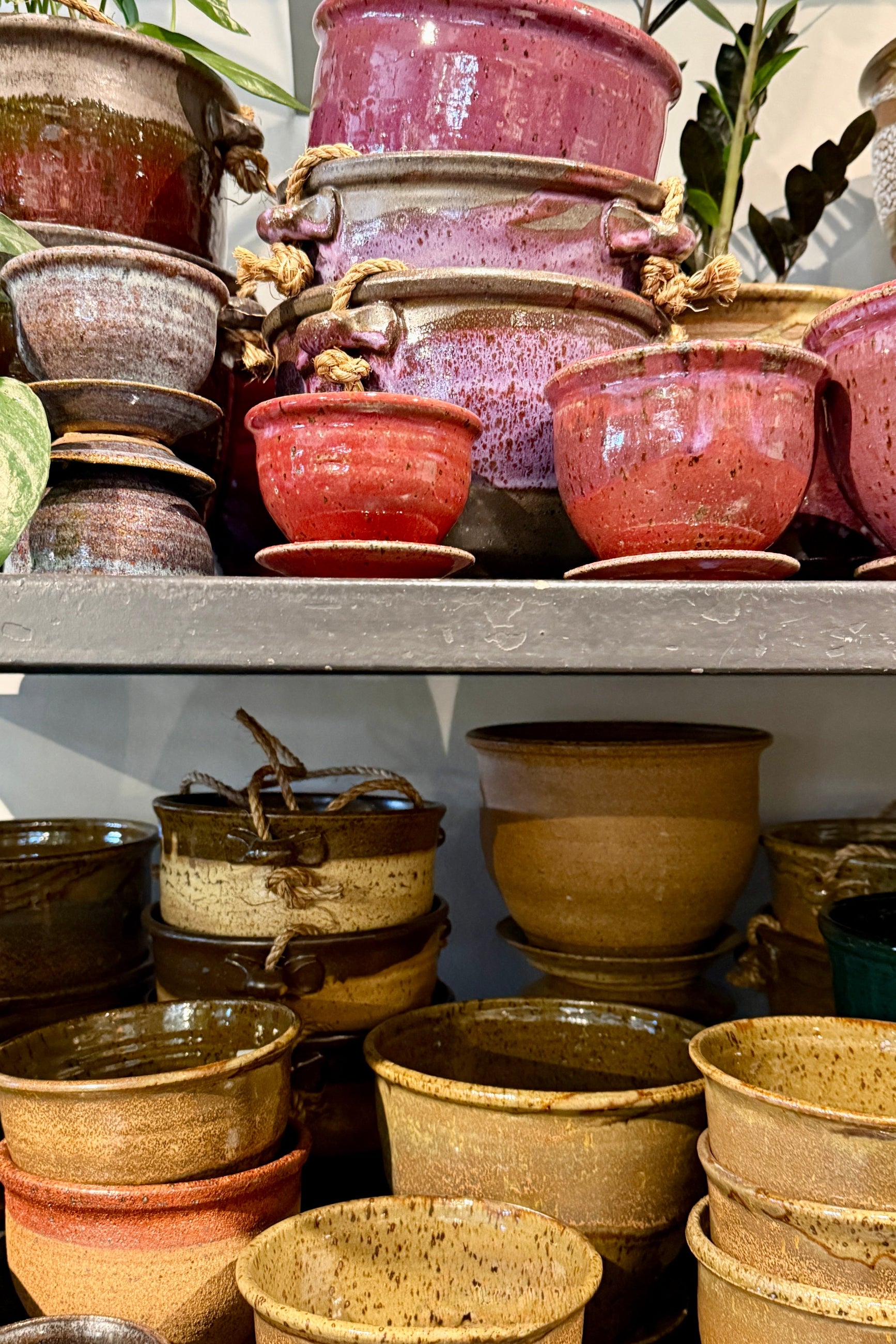 Collection of Bruning ceramic pots on a shelf at Sprout Home in Chicago with a neutral background ©Sprout Home