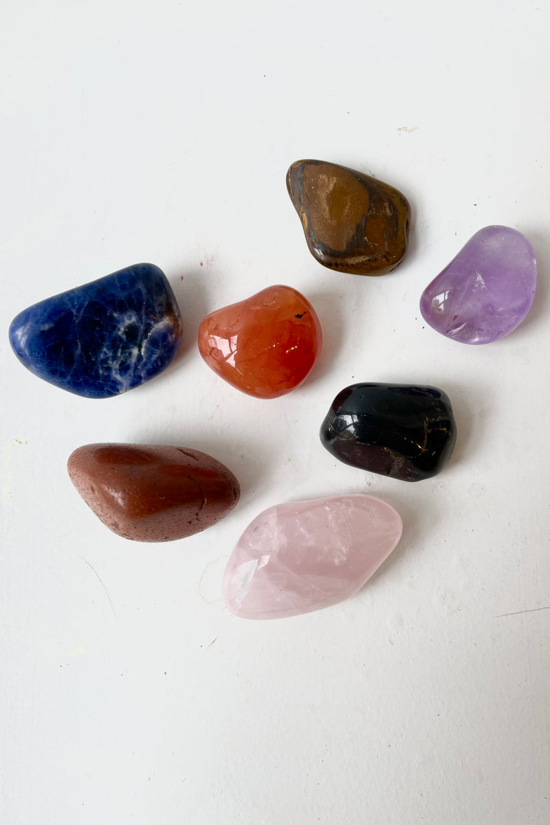 Assorted Polished stones against white background