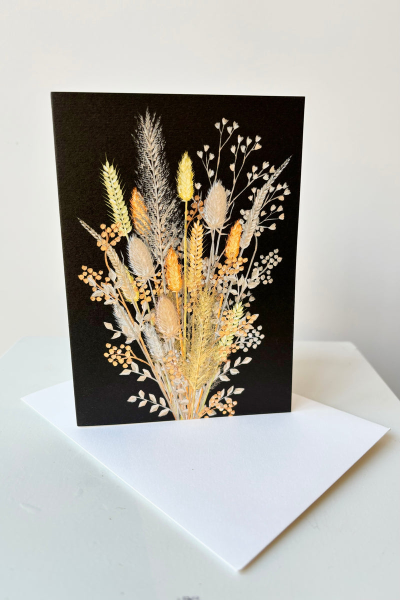 Dried stems greeting card with envelope against white background