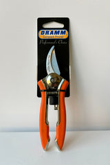 Dramm compact pruner in orange against white background