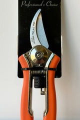 Close up of Dramm compact pruner in orange color against white background