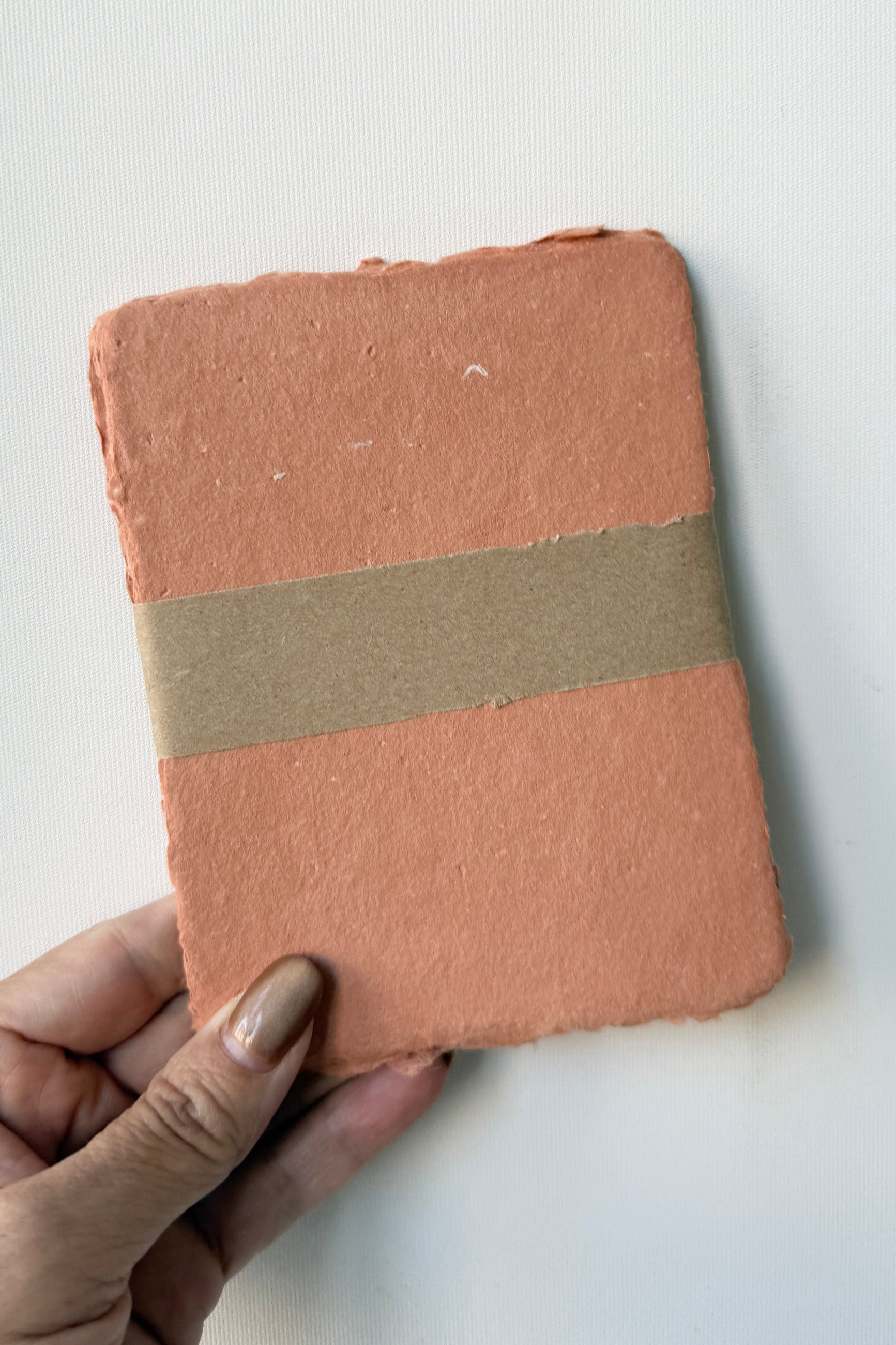 Handmade Terracotta Paper Sheet Set in A2 being held in hand ©Sprout Home