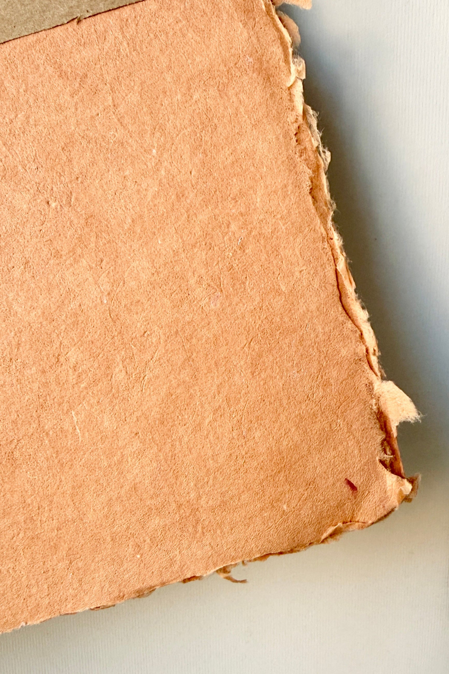 corner of a Handmade Terracotta Paper Sheet Set in 8x10 ©Sprout Home