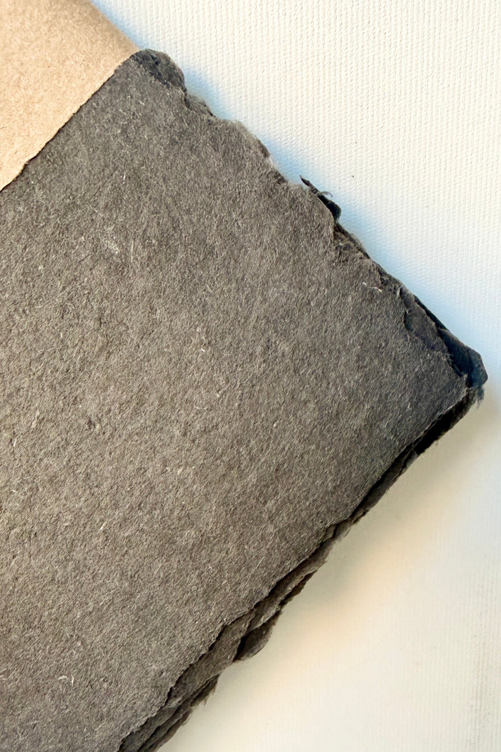 corner of a Handmade Carbon Paper Sheet Set in 5 x 7" showing the deckled edge ©Sprout Home