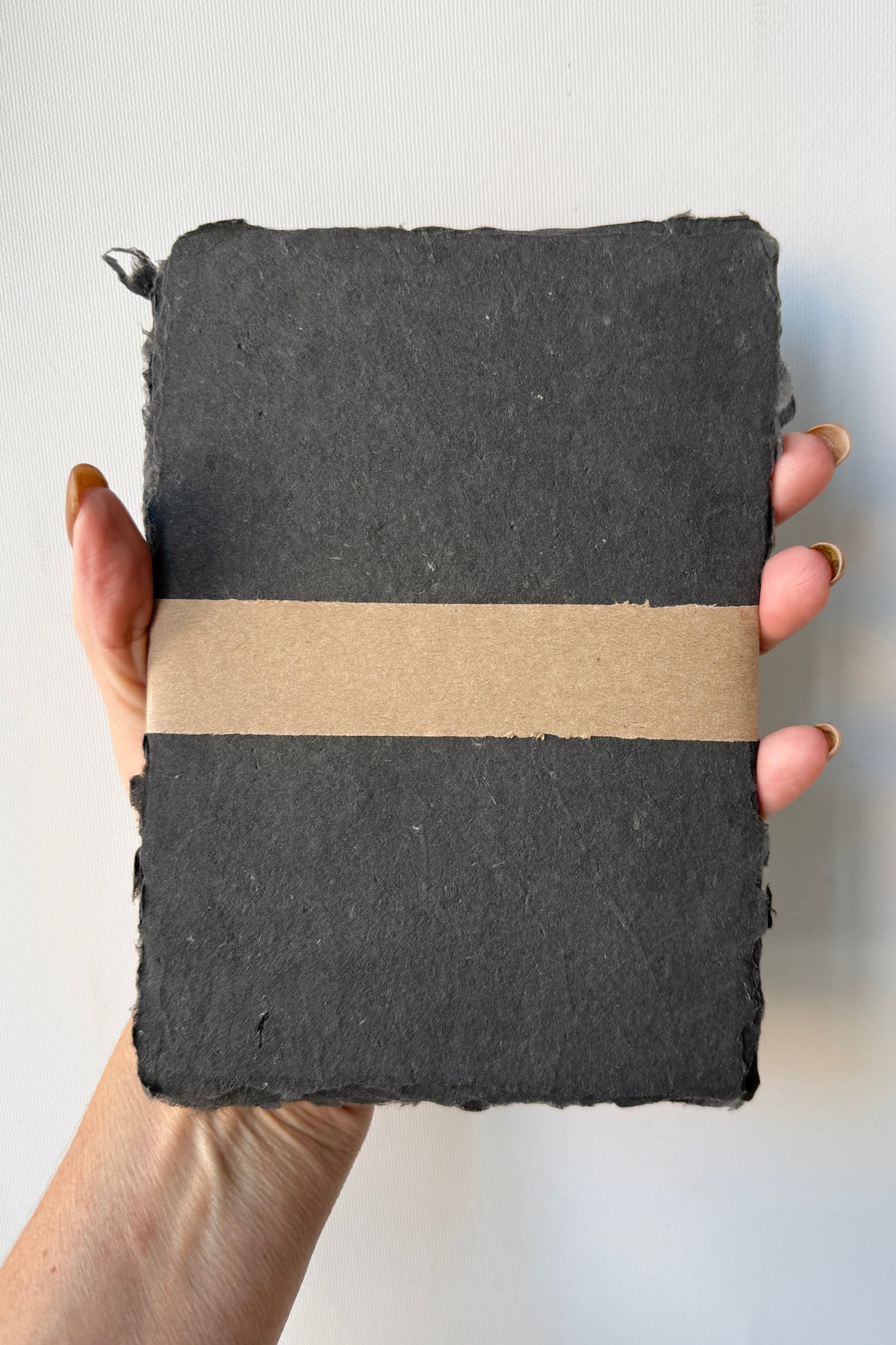 Handmade Carbon Paper Sheet Set in 5 x 7" beng held in hand ©Sprout Home