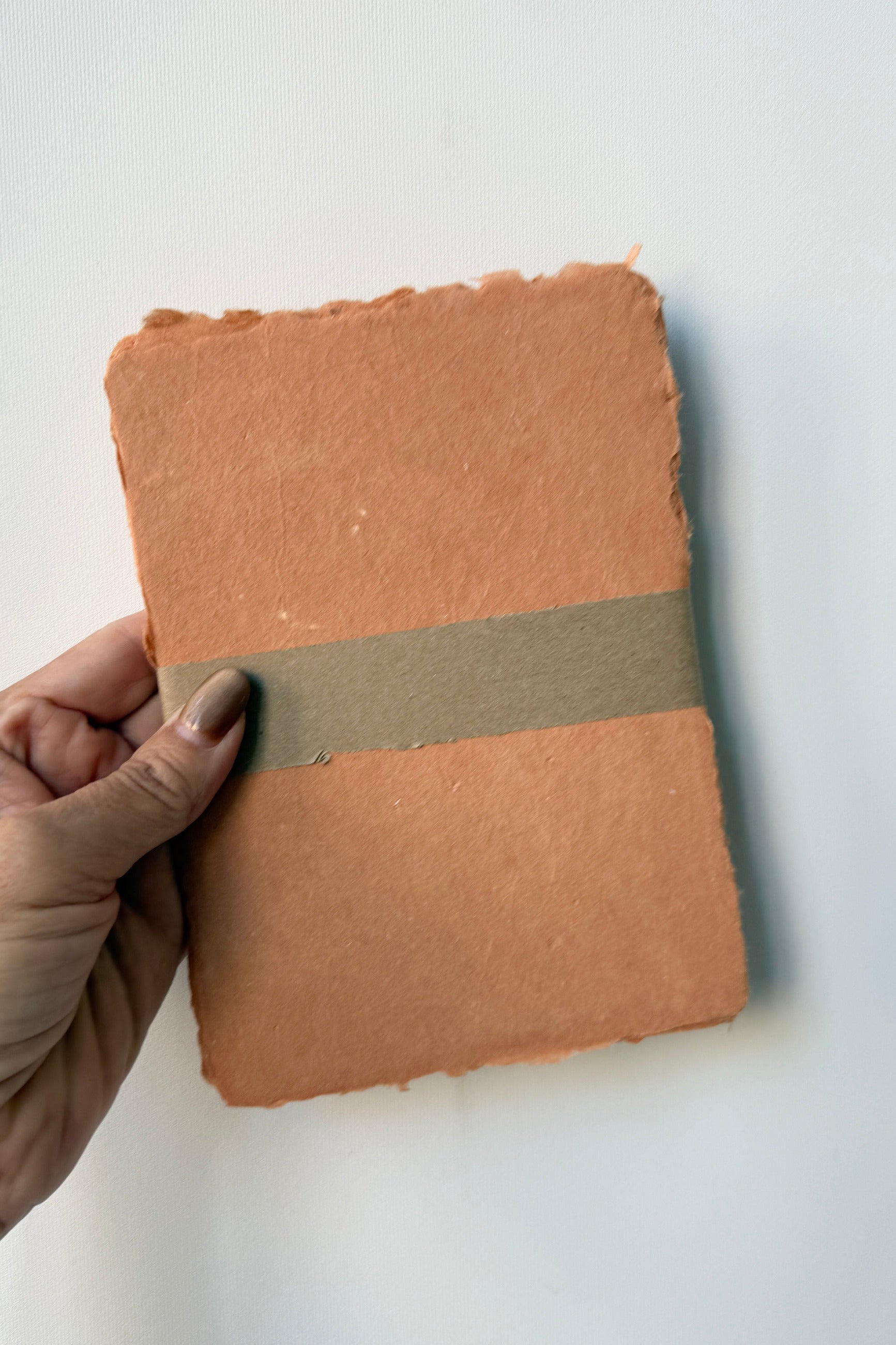 Handmade Terracotta Paper Sheet Set in 5 x 7" against a white wall ©Sprout Home