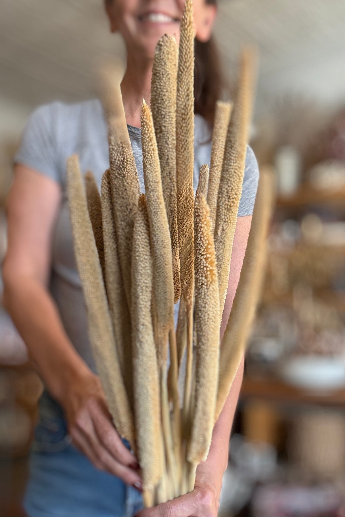 Babala Natural Color Preserved Bunch being held in hand with a blurry background ©Sprout Home