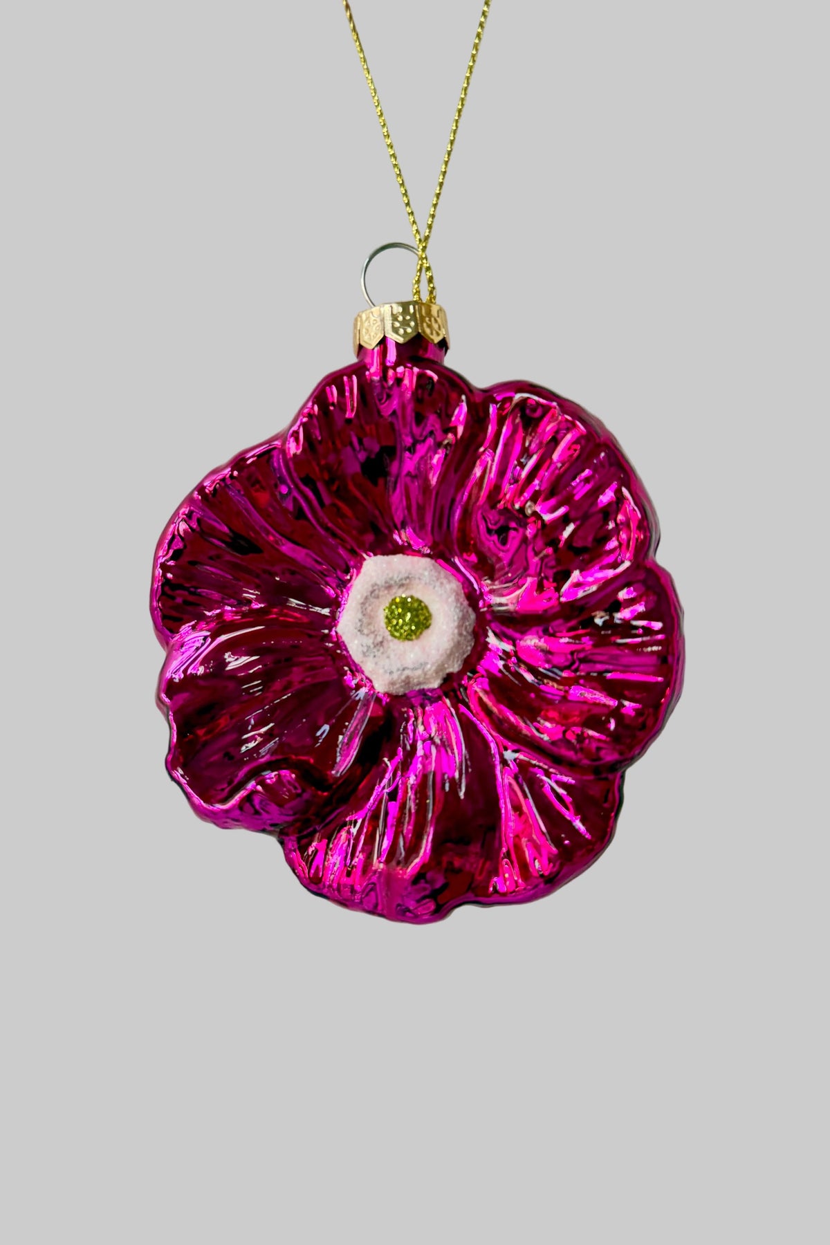 Pink Poppy Ornament against a grey wall ©Sprout Home