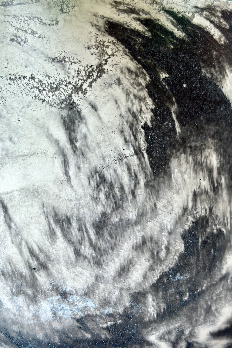 Close up of Marbled black and white varnished cement planter with drain hole and saucer 