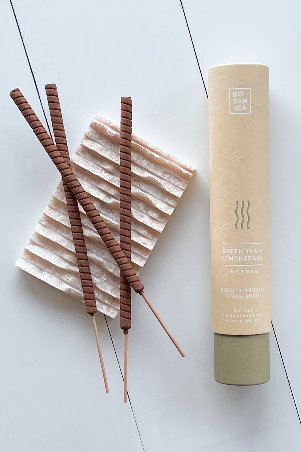 Botanical Green Tea and Lemongrass incense packaging tube and three sticks to its side