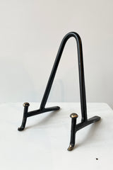 The Small Cast Iron display stand in small viewed at eye level from the front side. 