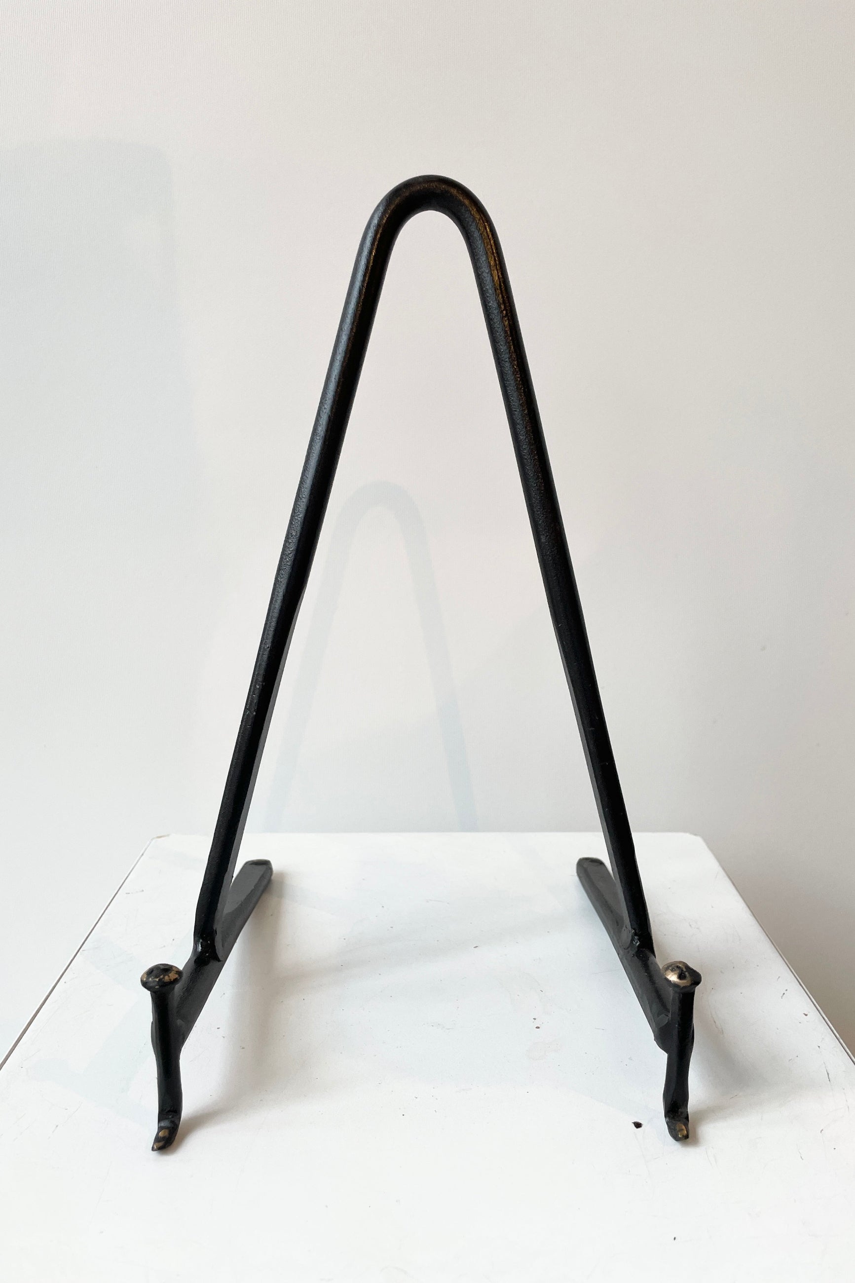 Cast Iron display stand in a medium size shown from the front.  ©Sprout Home