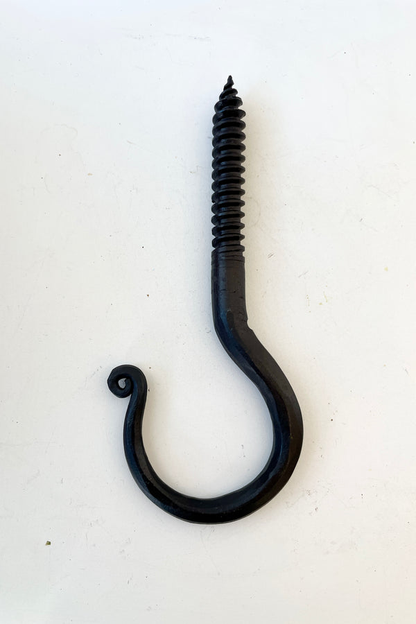 A threaded blacksmiths hook at Sprout Home being shown from the side. 