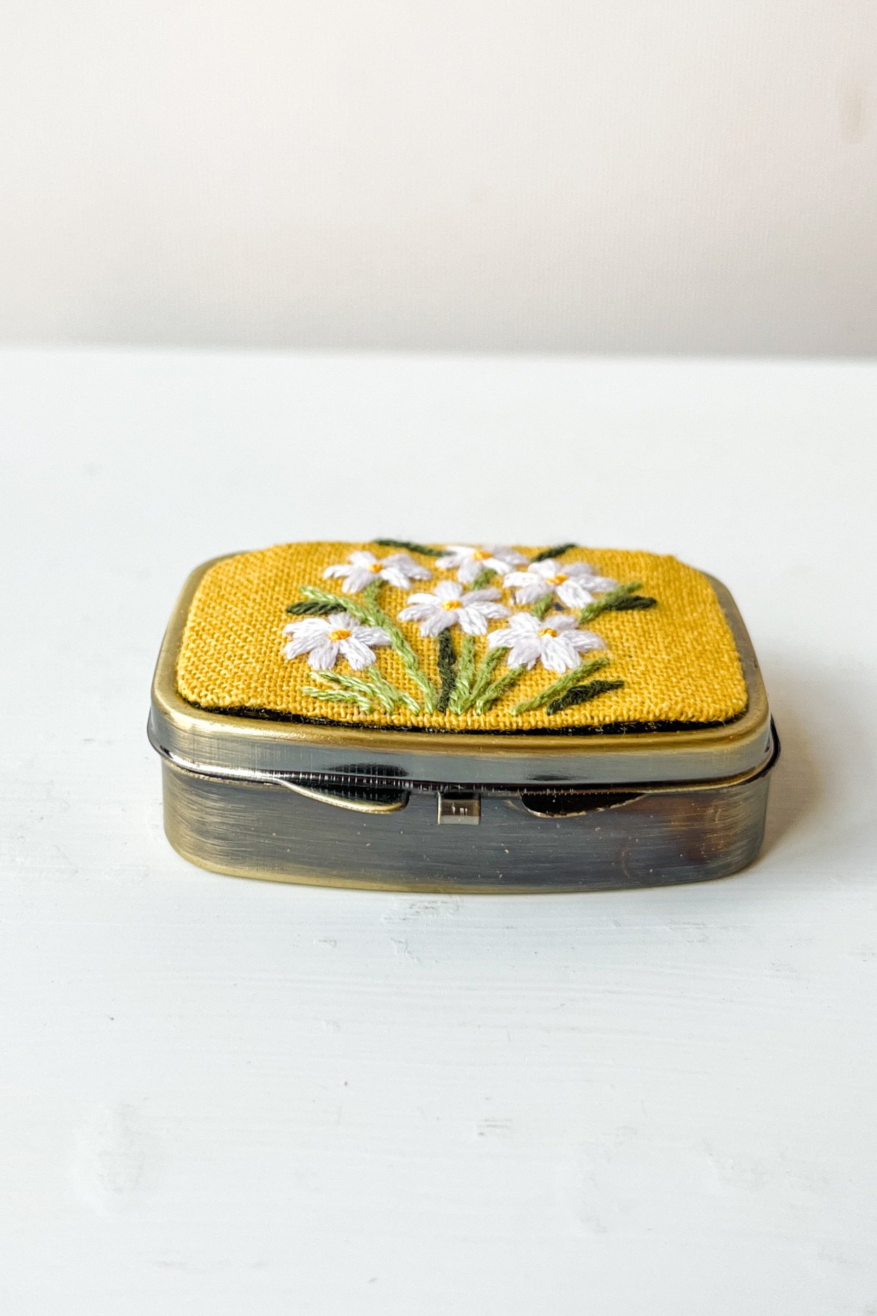 Small decorative box with floral design on a white background ©Sprout Home