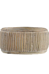 The small faux rattan shallow planter shown from the side unplanted and against a white background