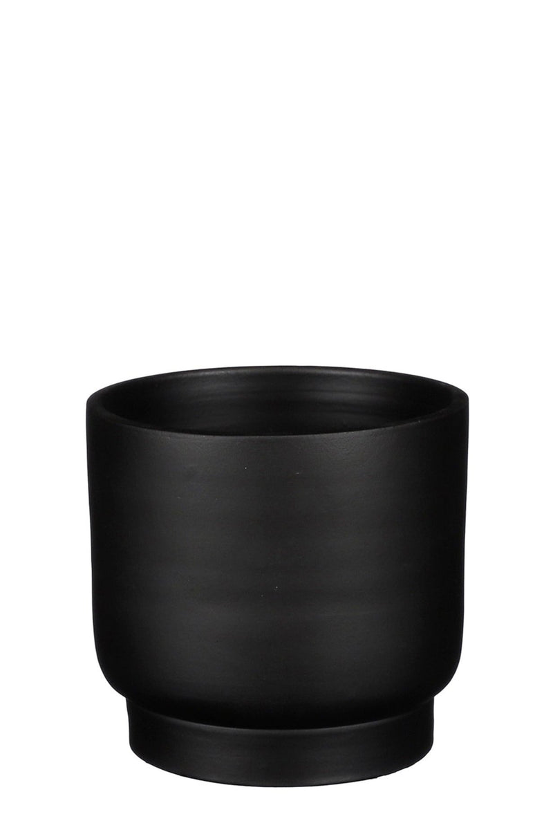 Riva black ceramic pot against a white backdrop and empty