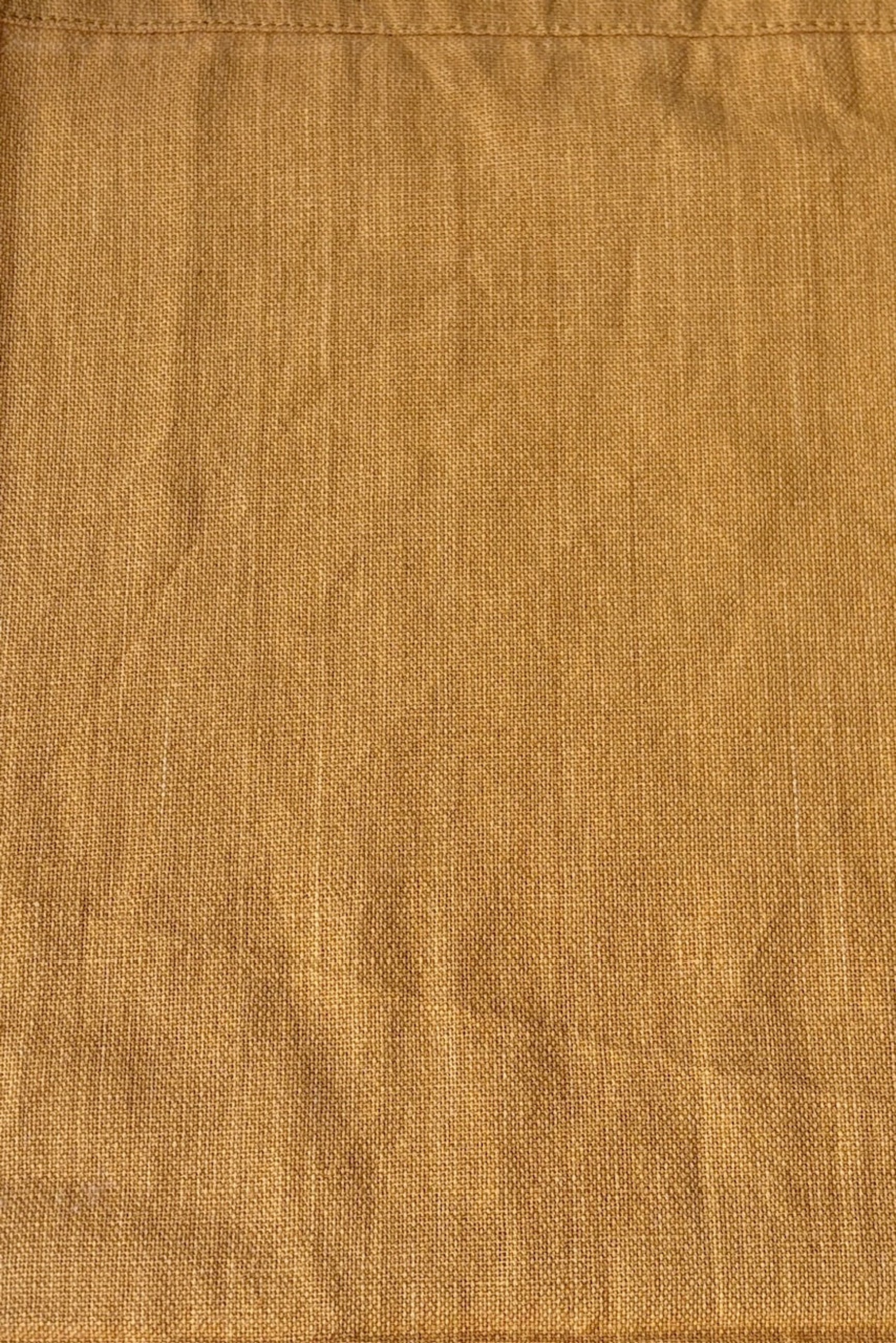 Close up of 100% cotton, homespun, handwoven napkin in mustard ©Sprout Home