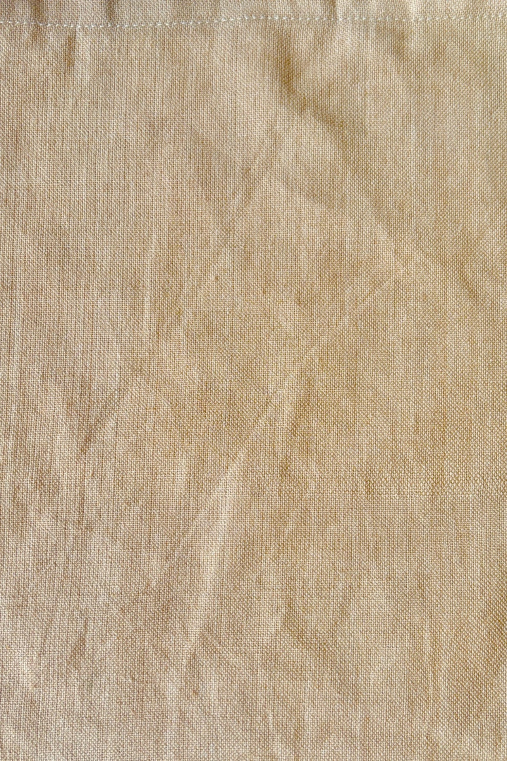 Close up of 100% cotton, homespun, handwoven napkin in sand ©Sprout Home