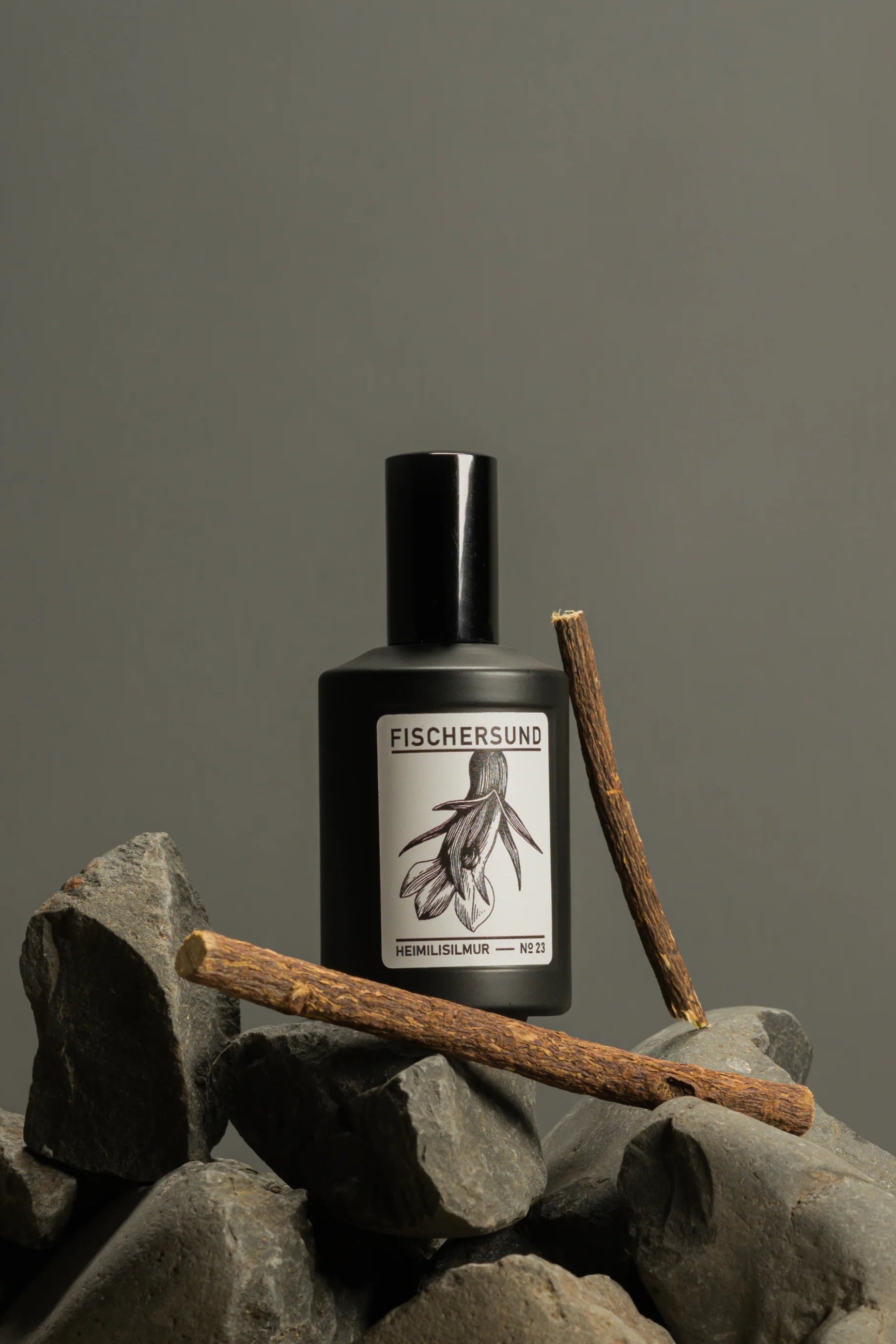 Fischersund Home Spray #23 sitting on rocks showing the front of the bottle
