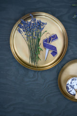 Brass plate by Fog Linen Work with lavender stems and a pair of scissors. 