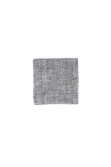 Black Herringbone coaster by Fog Linen on a white backdrop.