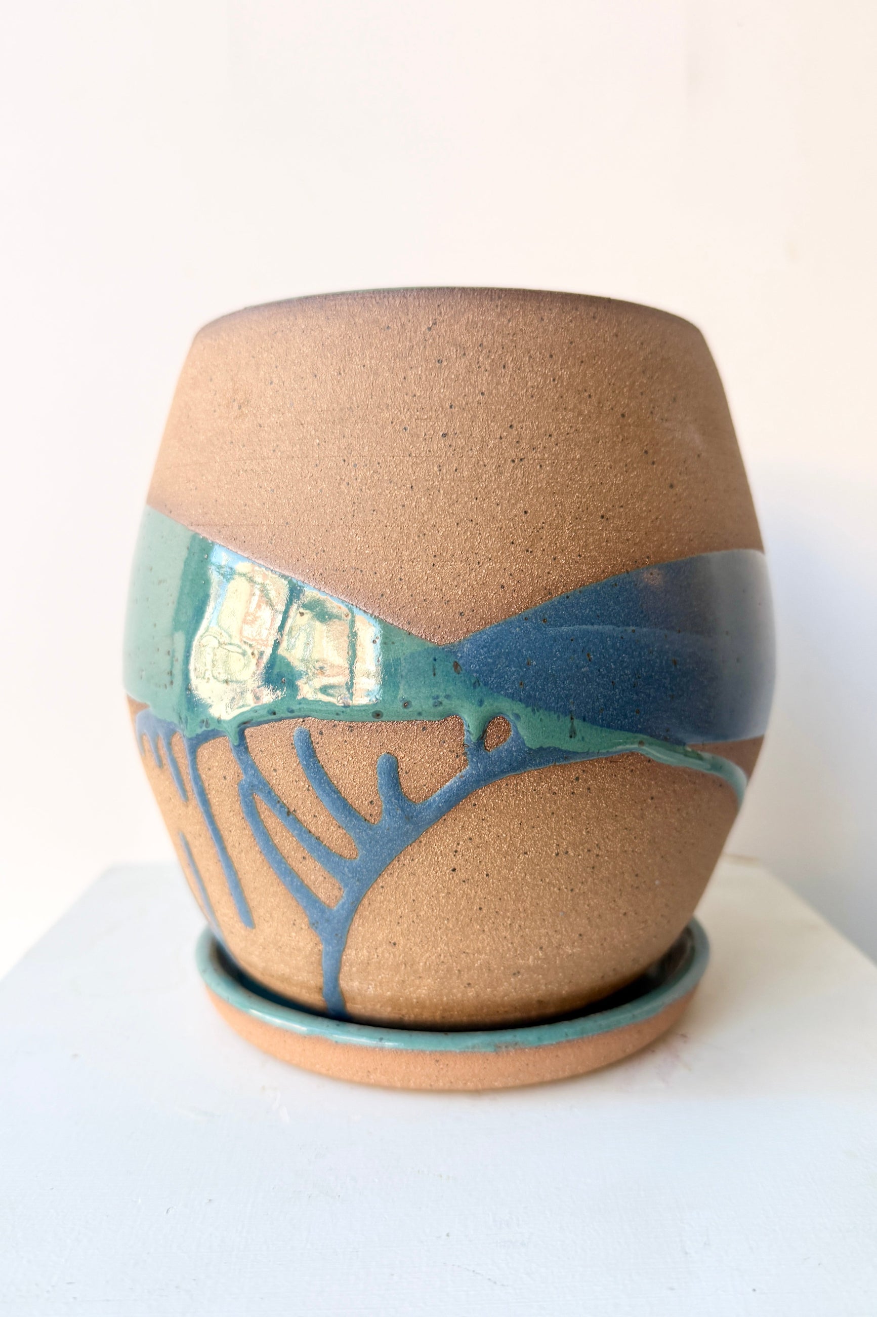 handmade Ceramic pot with denim and teal abstract design on a white background by Christina Kosinski ©Sprout Home