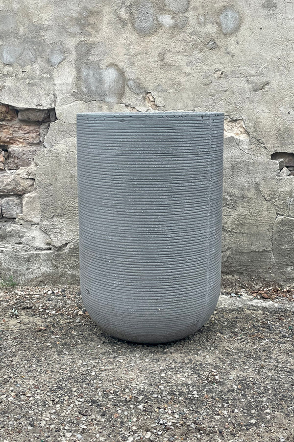 Cody High Pot horizontal ridged dark grey medium against a grey wall