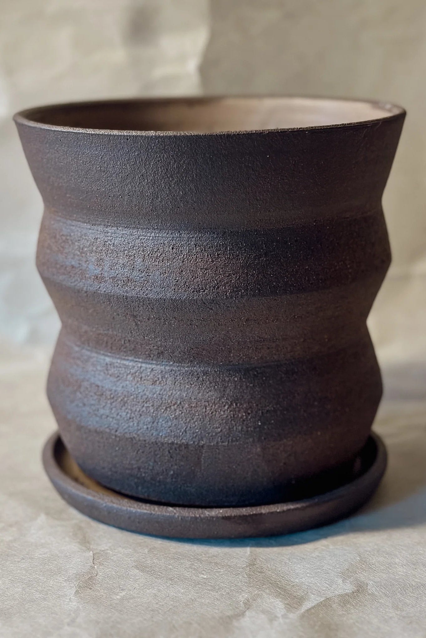 Olivia Snow Ceramics brown angled planter shown from the side empty ©Olivia Snow Ceramics