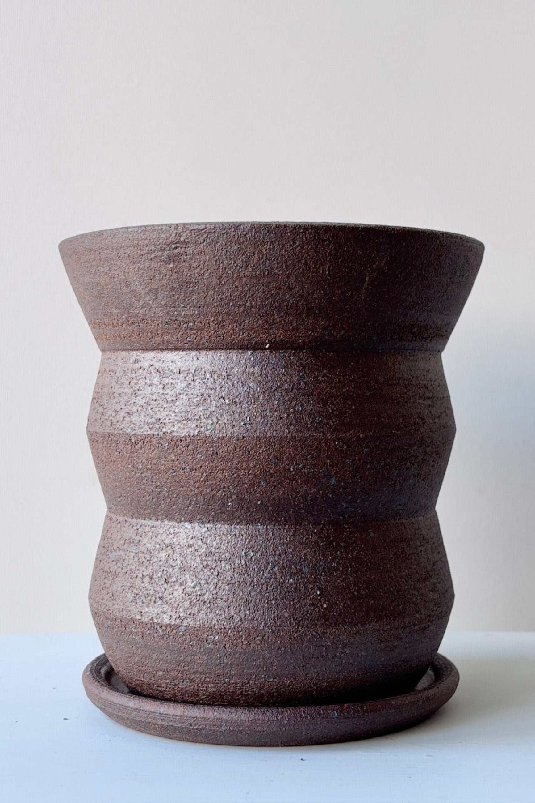 Olivia Snow Ceramics brown angled planter shown from the side empty ©Sprout Home 