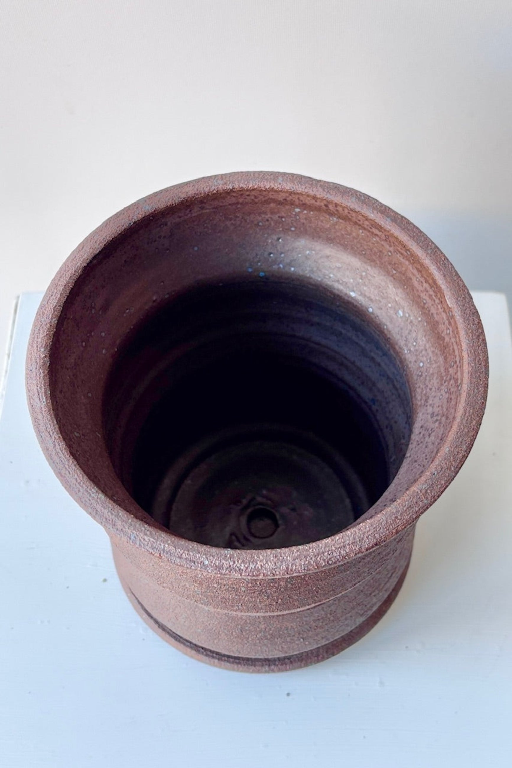 Overhead view of Olivia Snow Ceramics brown on a white table ©Sprout Home 