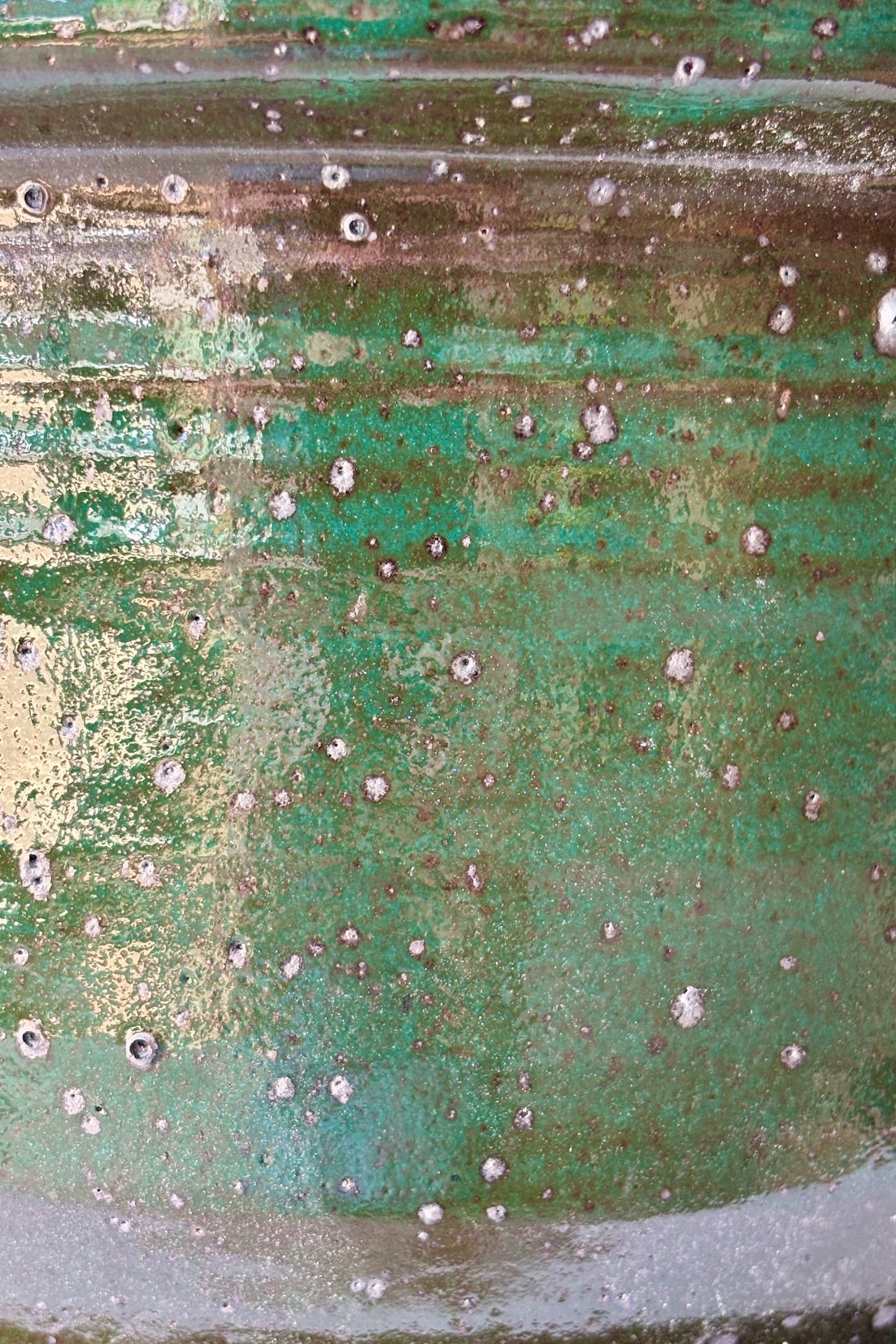 Close up of planter with jade green glaze flecked with silver specks, coloration may vary ©Sprout Home