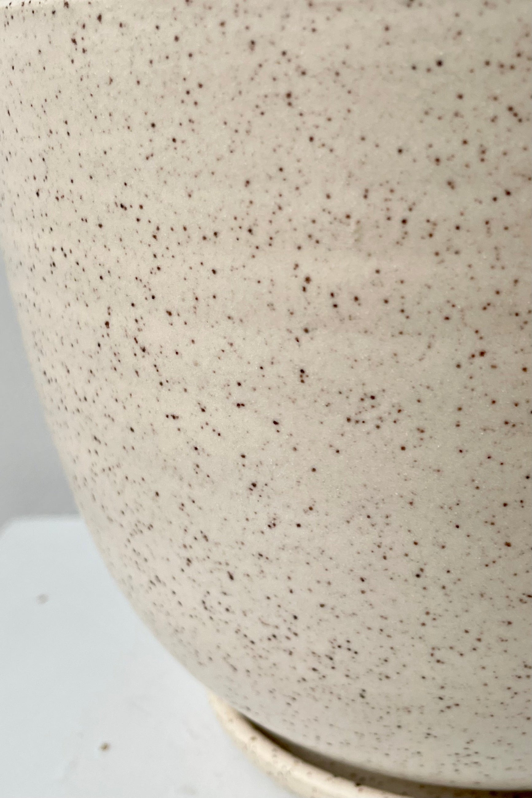Detail showing the Cream Speckle Finish.  ©Sprout Home