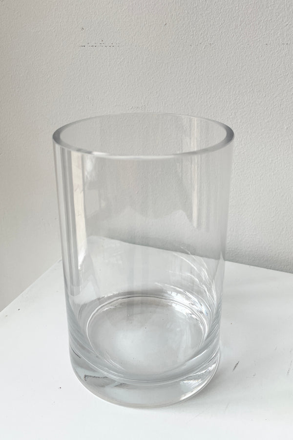 A clear glass vase being viewed from above and side.