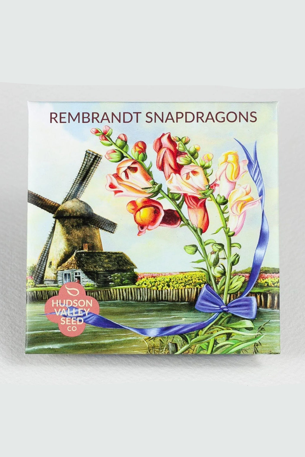 Seeds packet with Rembrandt Snapdragons design featuring a windmill and flowers, branded with Hudson Valley Seed Co. ©Hudson Valley Seed Co.