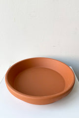 Clay saucer red to fit 8" looking from above and side.
