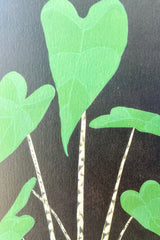 A close up picture of the Stengun alocasia zebrina card showing the detail of the green heart shaped leaves and striped stems. 