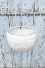 looking from the topside in to the Spherical Hanging planter in creamy white. 