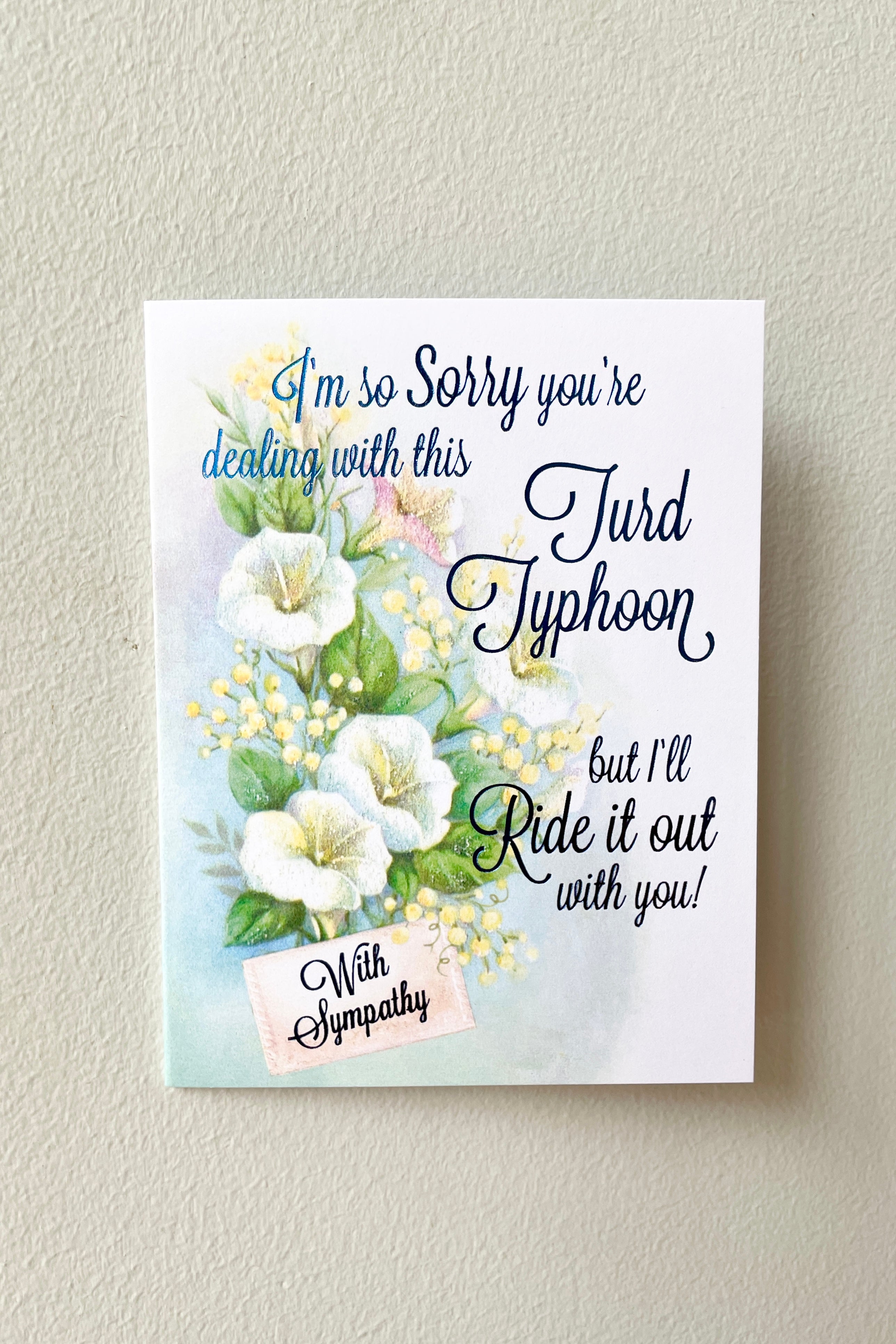 Turd Typhoon sympathy card with blue foil. 