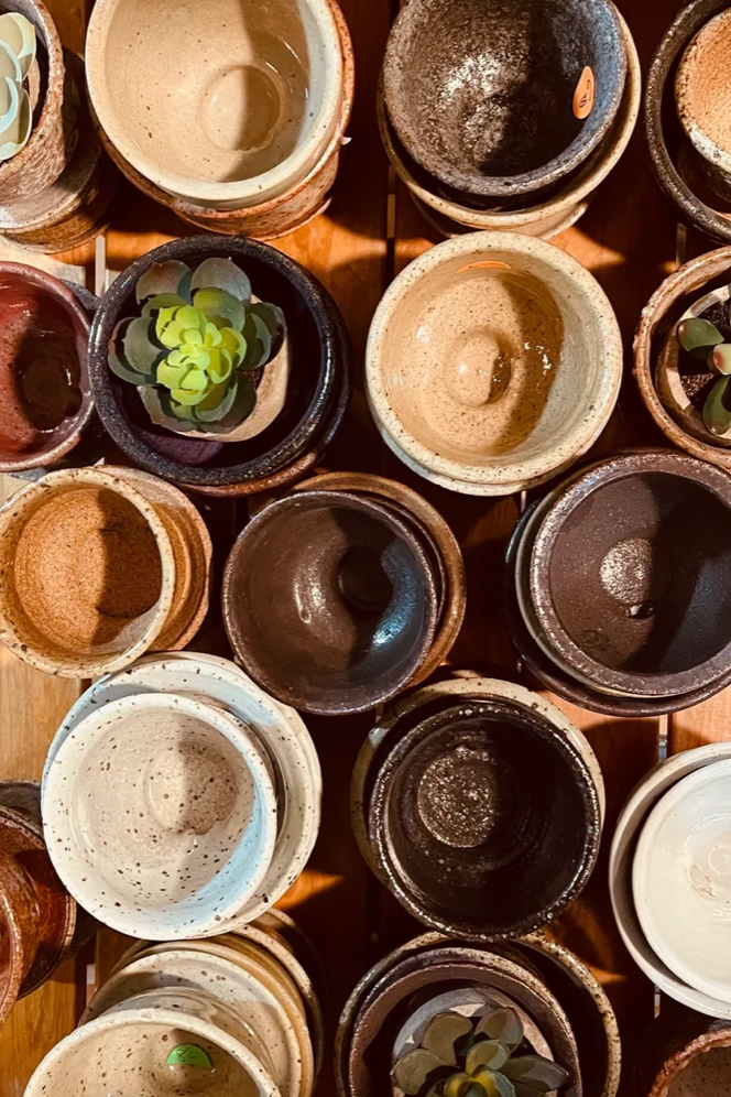 a group of Bruning Pottery shown from a above.