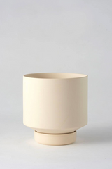 A sand colored Collectors Gro Pot by Angus & Celeste empty against a white backdrop. 