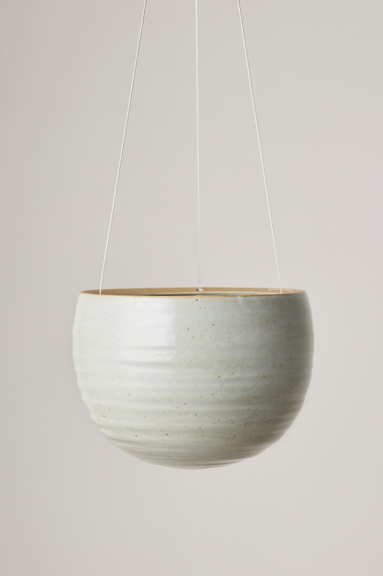 Spherical Hanging Planter
Grey Crackle by Angus & Celeste hanging empty against a white wall. 