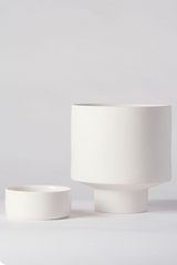  white Collector's Gro pot by Angus & Celeste shown with its saucer to the side of the pot 