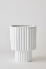 White colored Modular Stack planter by Angus & Celeste being shown empty in front of a white wall. 