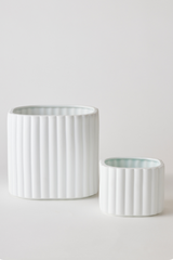 White colored Modular Stack planter by Angus & Celeste with its two parts separated and shown from the side. 