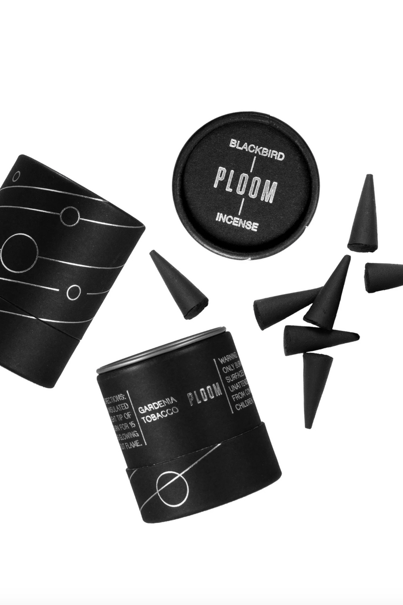 Ploom incense by Blackbird shown open and its parts displayed on top of a white background. 