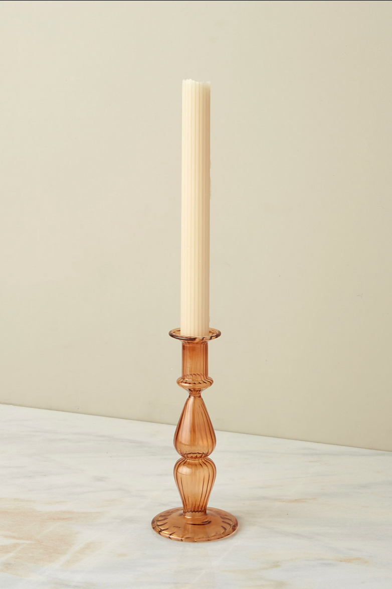 The marmalade Nahlia candlestick holder with an ivory taper candle. 