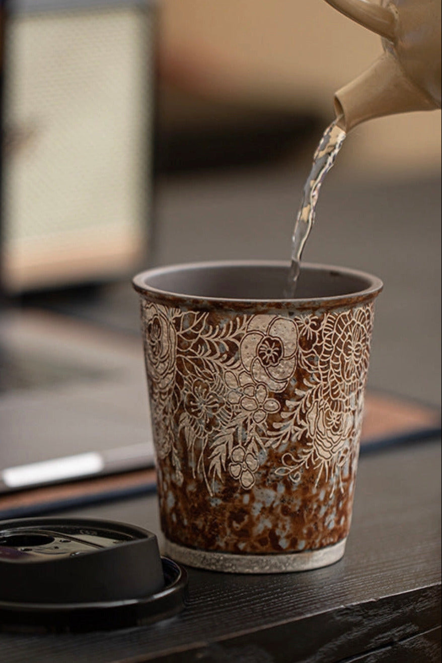 Silver Glaze Handmade Engraved Ceramic Coffee Mug with water being poured in to it ©Haku