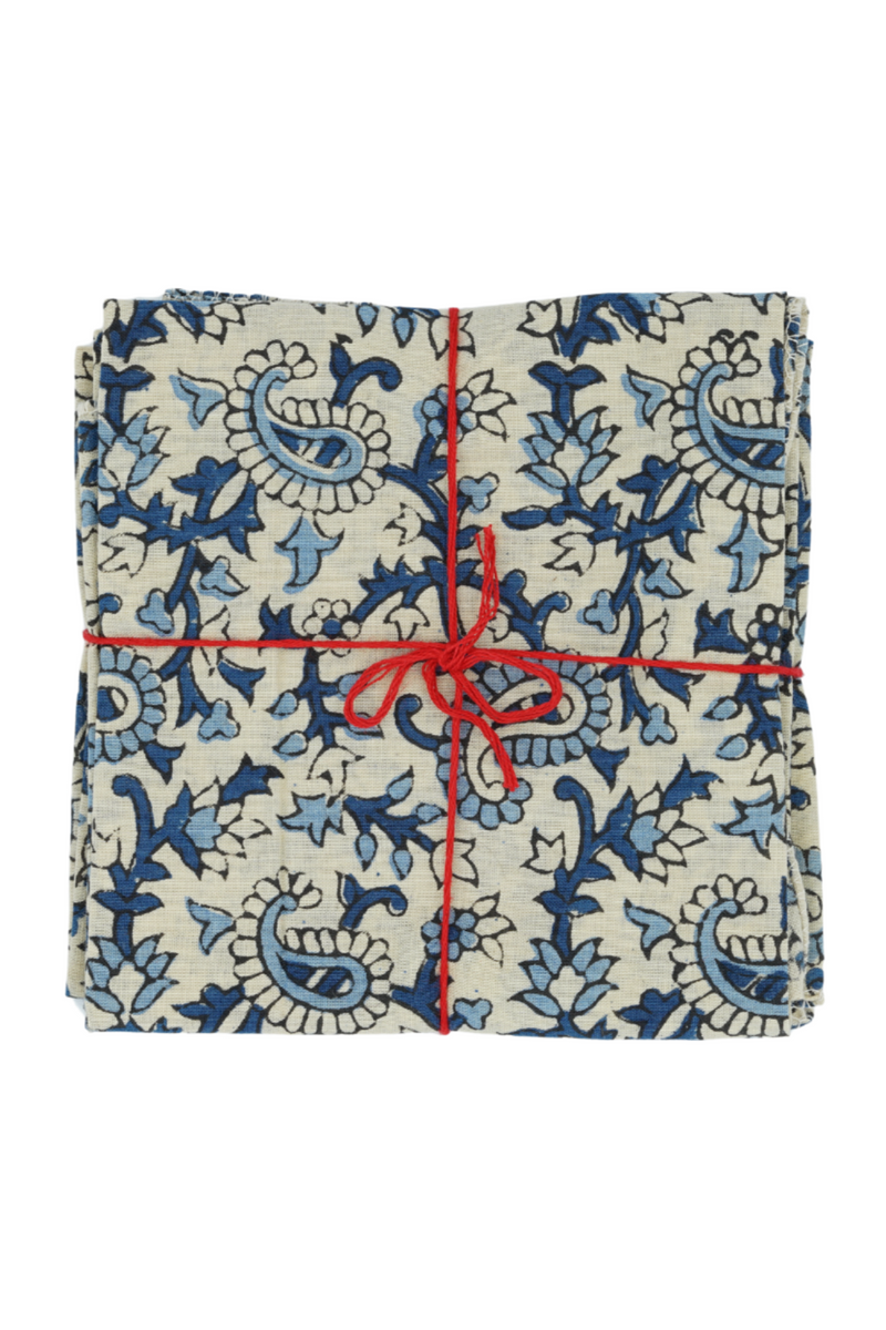 Suzette Cotton Napkins Pourpier Cobalt tied with a red string. 