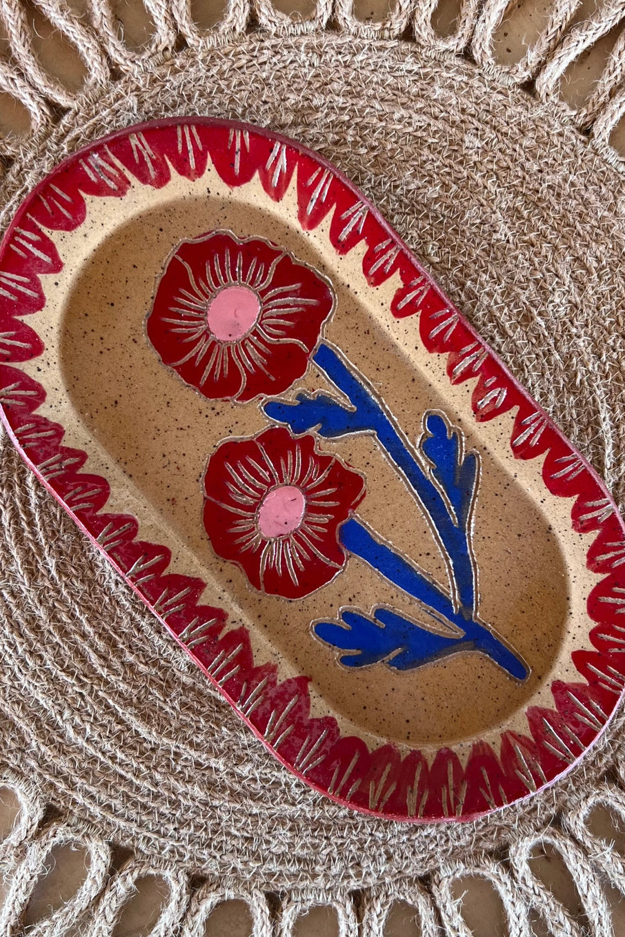 Decorative Red & Blue Blossom Sgraffito Dish ceramic plate with floral design on a textured surface ©Tough Kitty Designs