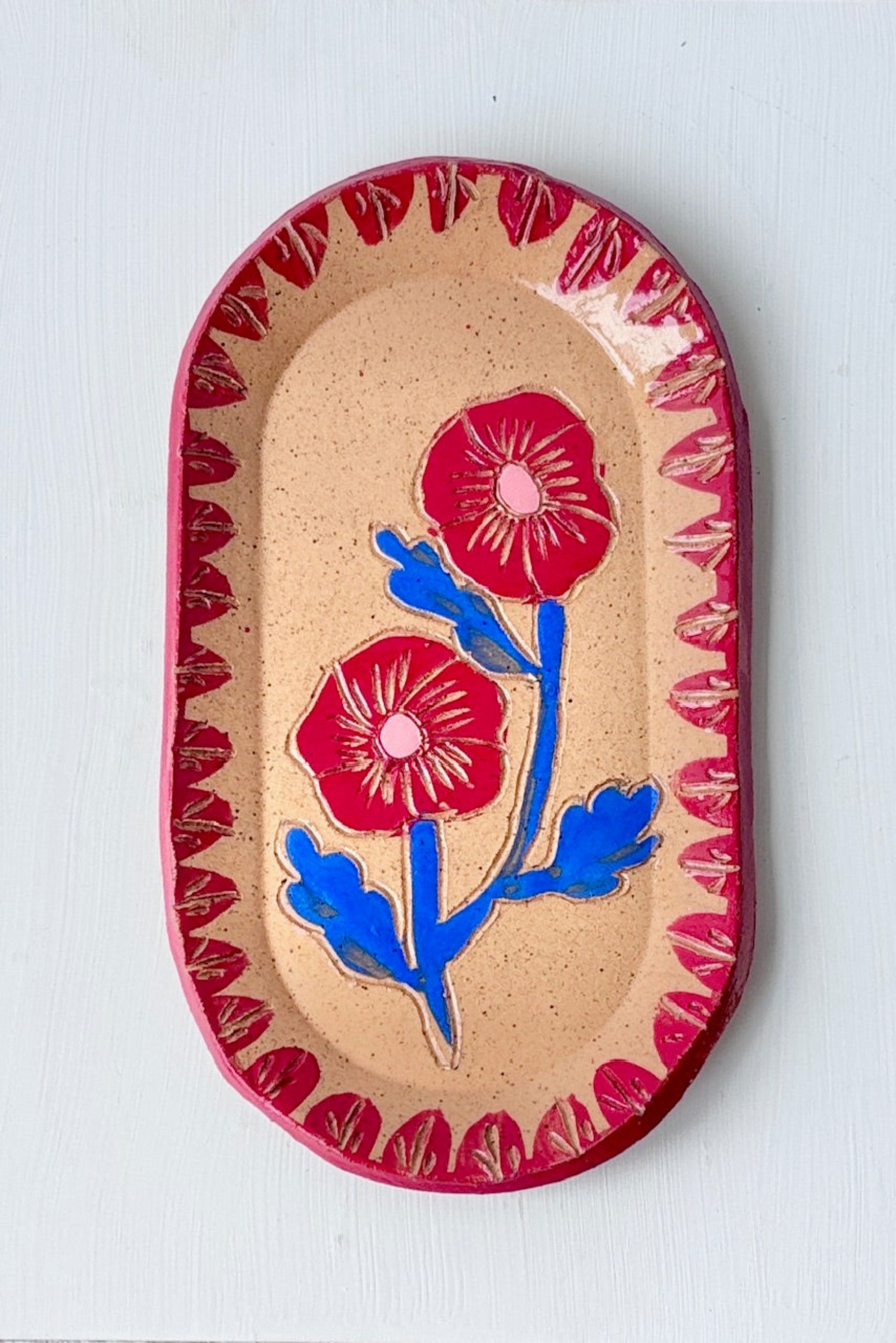 Decorative Red & Blue Blossom Sgraffito Dish ceramic plate with floral design on a white surface ©Sprout Home